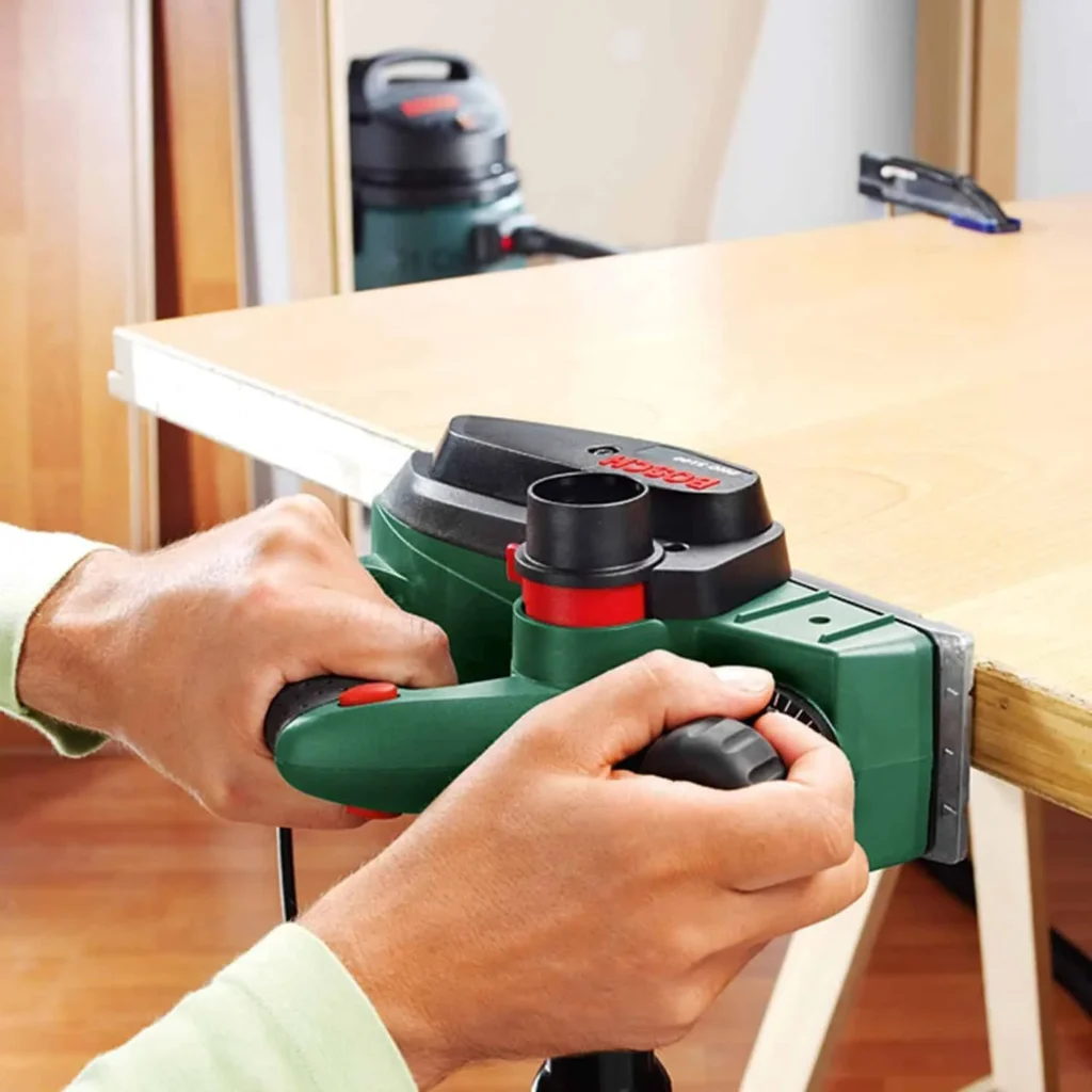 Bosch Planer PHO 2000 (680 W, planing width: 82 mm, cutting depth: 0 – 2.0 mm, rebating depth: 0 – 8 mm, with planing blade, in carton packaging)